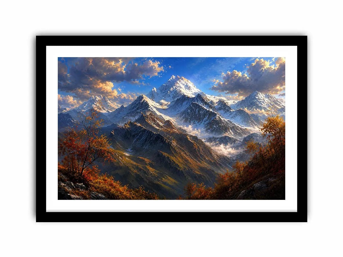Majestic snow-covered mountain peaks with autumn trees beneath a dramatic blue sky