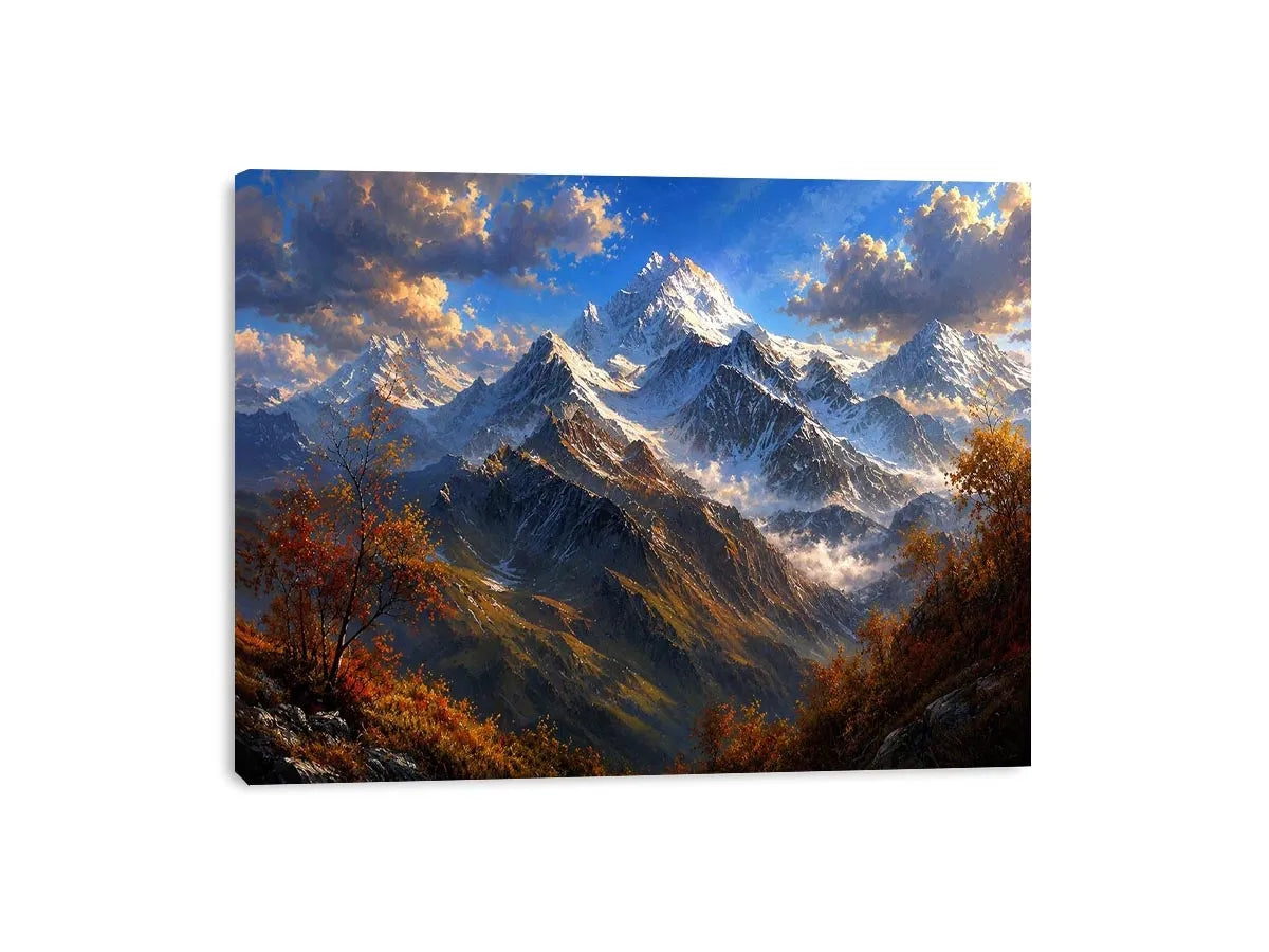Majestic snow-covered mountain peaks with autumn trees beneath a dramatic blue sky