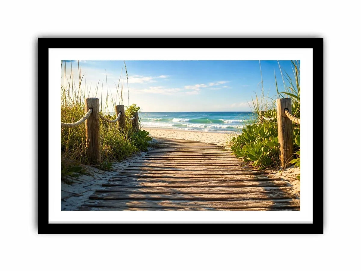 Wooden beach boardwalk leading through coastal dunes toward the ocean shoreline
