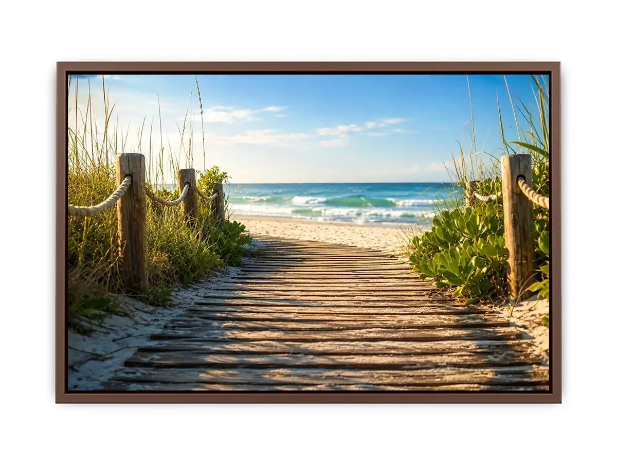 Wooden beach boardwalk leading through coastal dunes toward the ocean shoreline