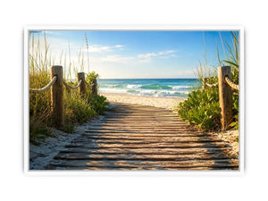 Wooden beach boardwalk leading through coastal dunes toward the ocean shoreline