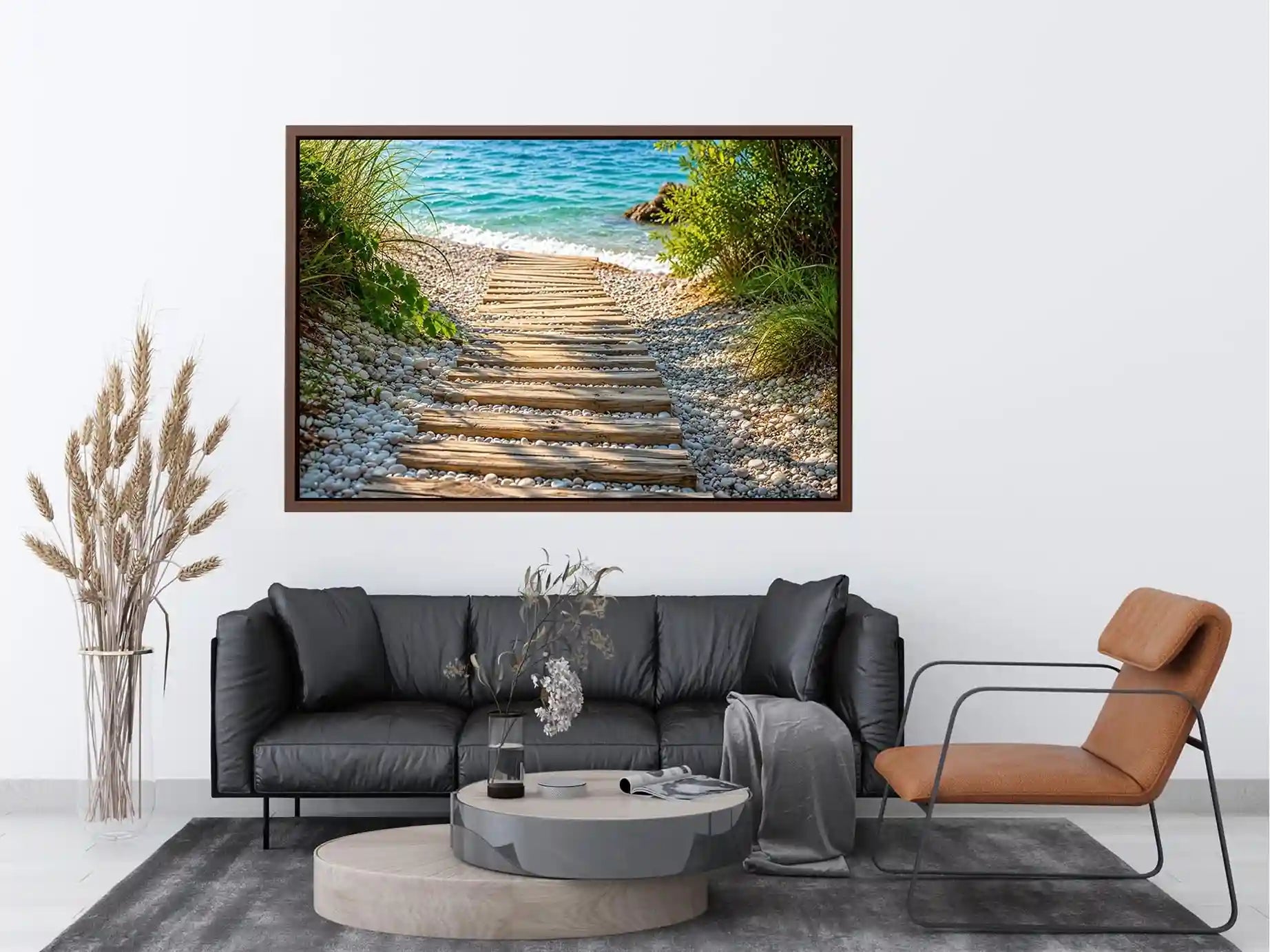 Rustic wooden pathway leading across a pebble beach toward turquoise ocean waves