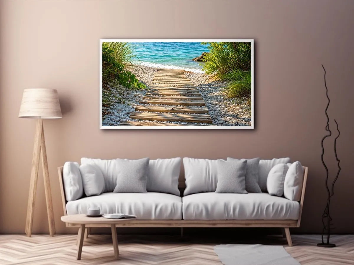 Rustic wooden pathway leading across a pebble beach toward turquoise ocean waves