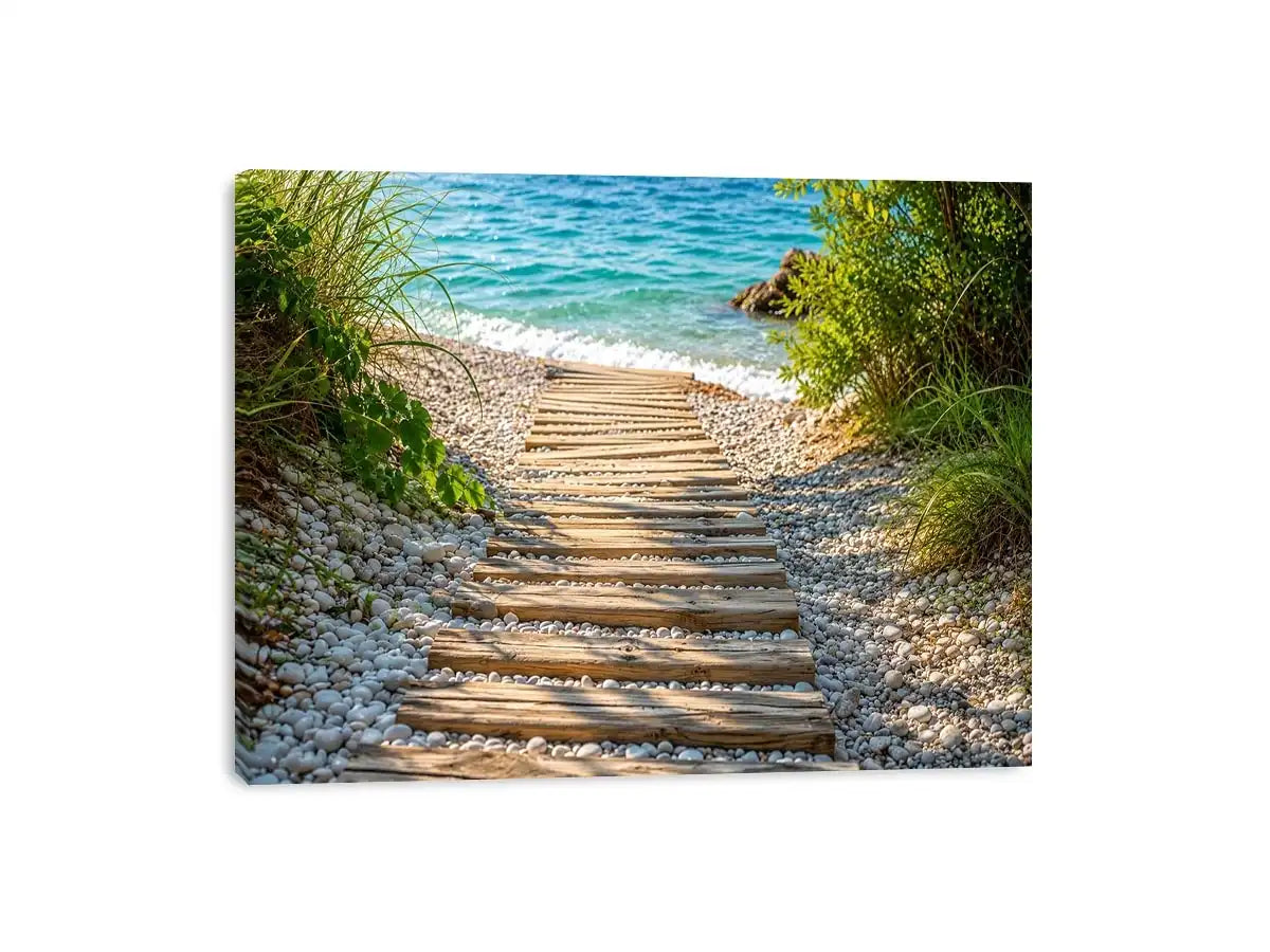 Rustic wooden pathway leading across a pebble beach toward turquoise ocean waves