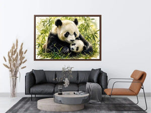 Watercolor painting of a mother panda cuddling a baby panda among bamboo leaves
