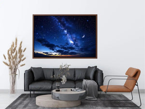 Peaceful night sky artwork featuring a crescent moon glowing among countless stars and deep blue clouds