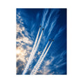 Modern jet formation wall art with airplane contrails against deep blue sky