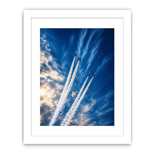 Modern jet formation wall art with airplane contrails against deep blue sky