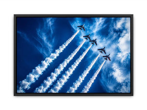 Modern aviation wall art featuring jet planes flying in formation with dramatic smoke trails across deep blue sky in dynamic photography style