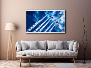 Modern aviation wall art featuring jet planes flying in formation with dramatic smoke trails across deep blue sky in dynamic photography style