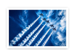 Modern aviation wall art featuring jet planes flying in formation with dramatic smoke trails across deep blue sky in dynamic photography style