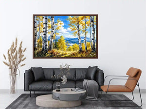 Watercolor birch forest wall art with golden autumn leaves, blue sky, and peaceful woodland landscape scenery
