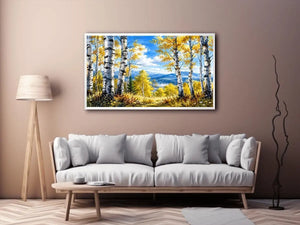 Watercolor birch forest wall art with golden autumn leaves, blue sky, and peaceful woodland landscape scenery