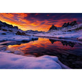 Snowy mountain sunset wall art with frozen lake reflection, colorful twilight sky and peaceful winter landscape photography.