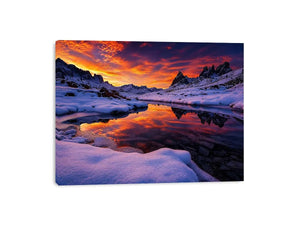 Snowy mountain sunset wall art with frozen lake reflection, colorful twilight sky and peaceful winter landscape photography.