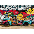 Vintage graffiti pickup truck wall art with colorful urban street mural background.
