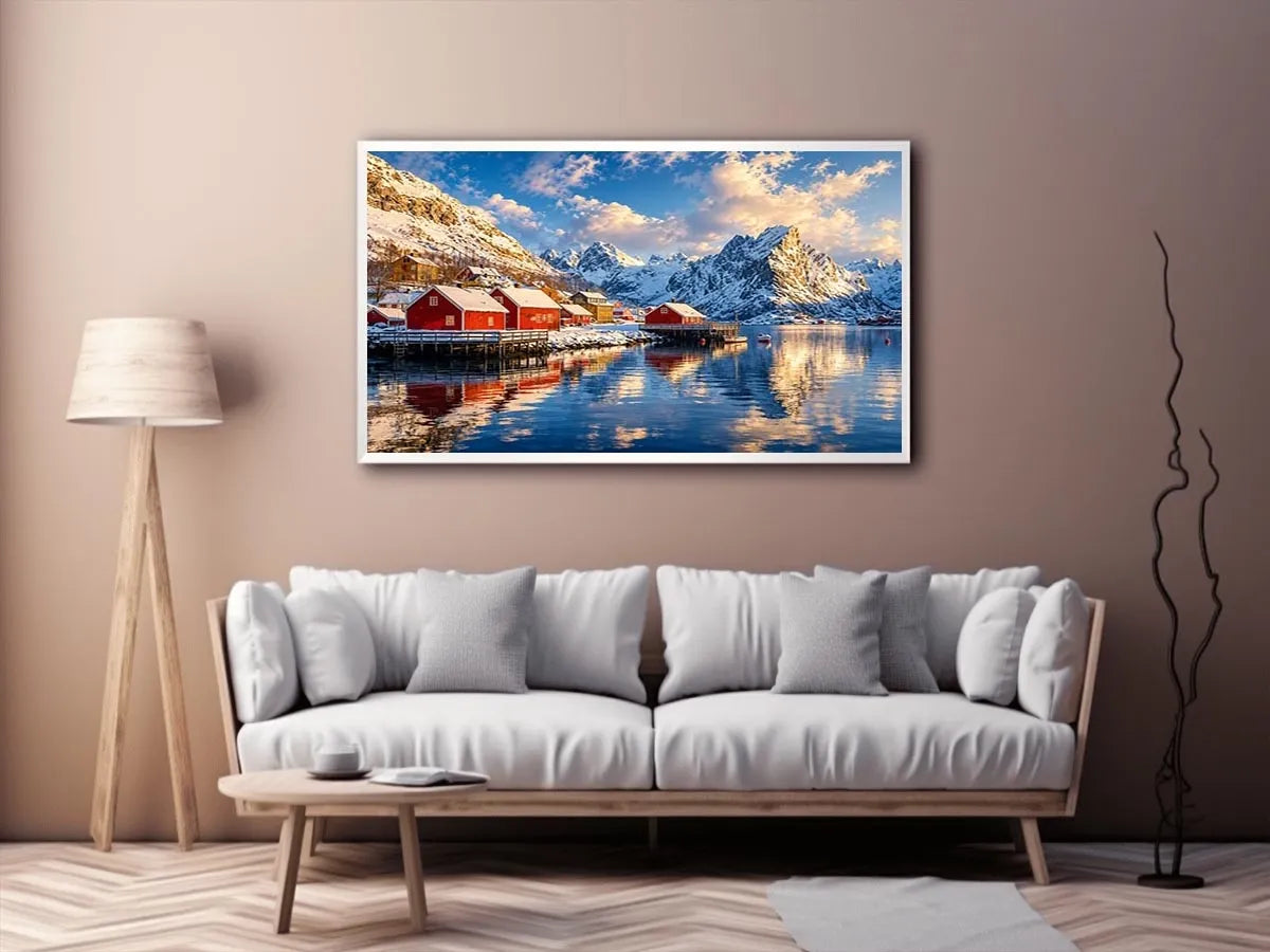 Scandinavian winter village wall art with snowy mountains and calm reflective water for cozy modern interiors.