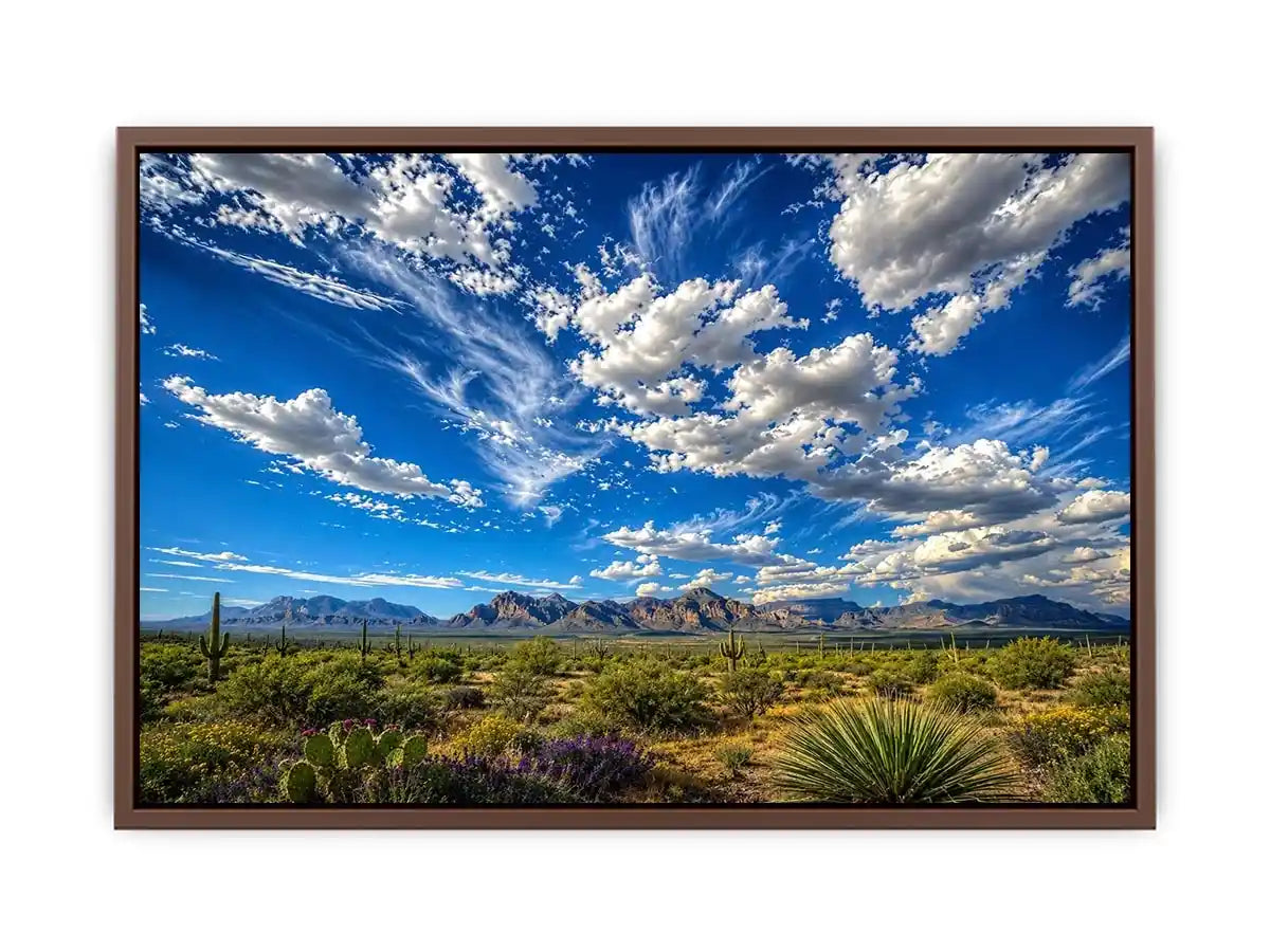 Southwestern desert landscape wall art with dramatic blue sky, mountains, and cactus scenery