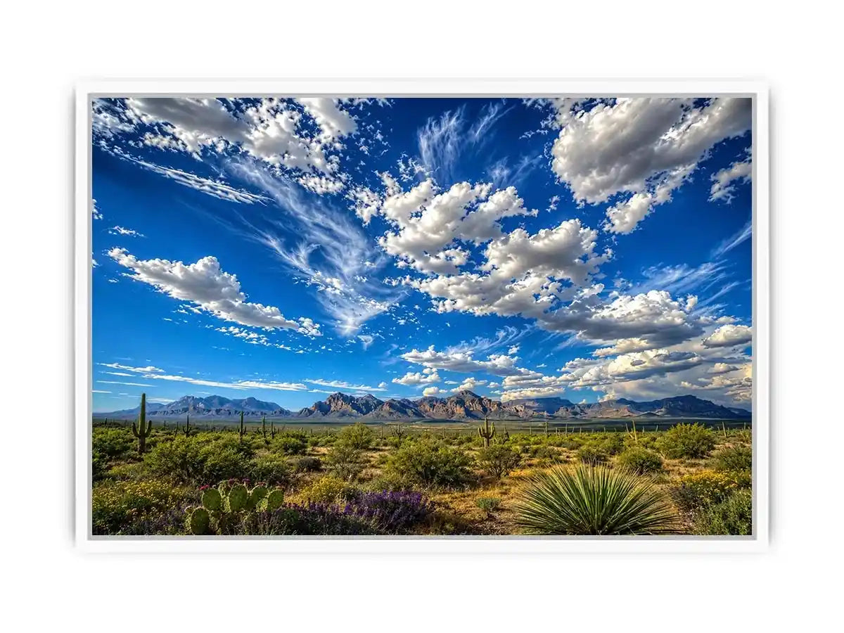 Southwestern desert landscape wall art with dramatic blue sky, mountains, and cactus scenery