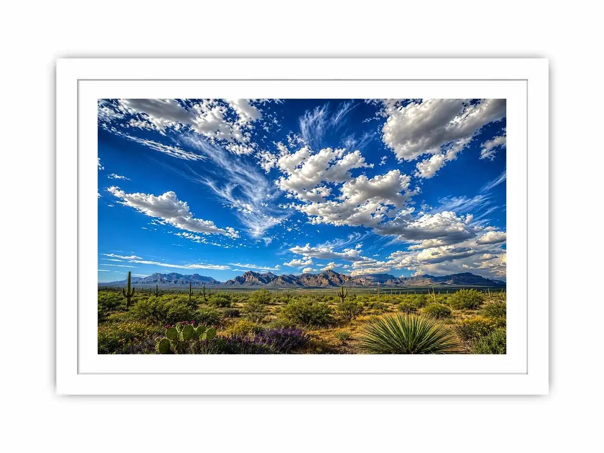 Southwestern desert landscape wall art with dramatic blue sky, mountains, and cactus scenery