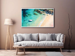 Tropical lagoon coastal painting with turquoise waters, sandy beach, and white boat floating near rocky shoreline