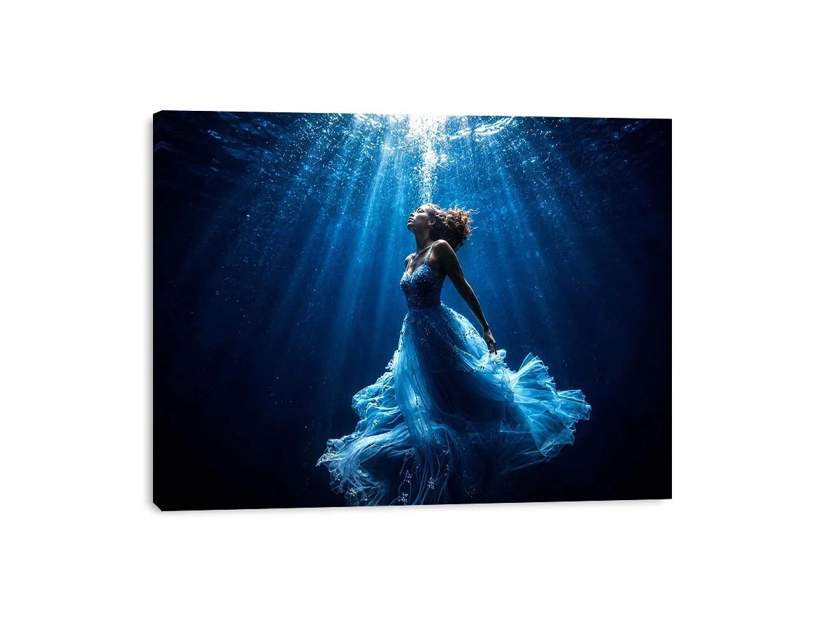 Luxury underwater woman canvas art with flowing blue dress for elegant modern bedroom or living room decor.