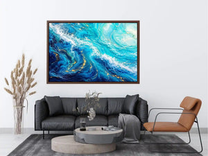 Abstract ocean wave canvas art in teal and white for modern coastal living room decor.