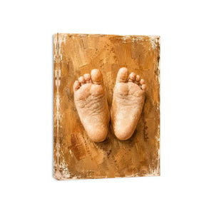 Neutral baby footprints canvas art for warm nursery and family room decor.