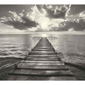 Black and white wooden pier over calm sea with clouds for bedroom decor.