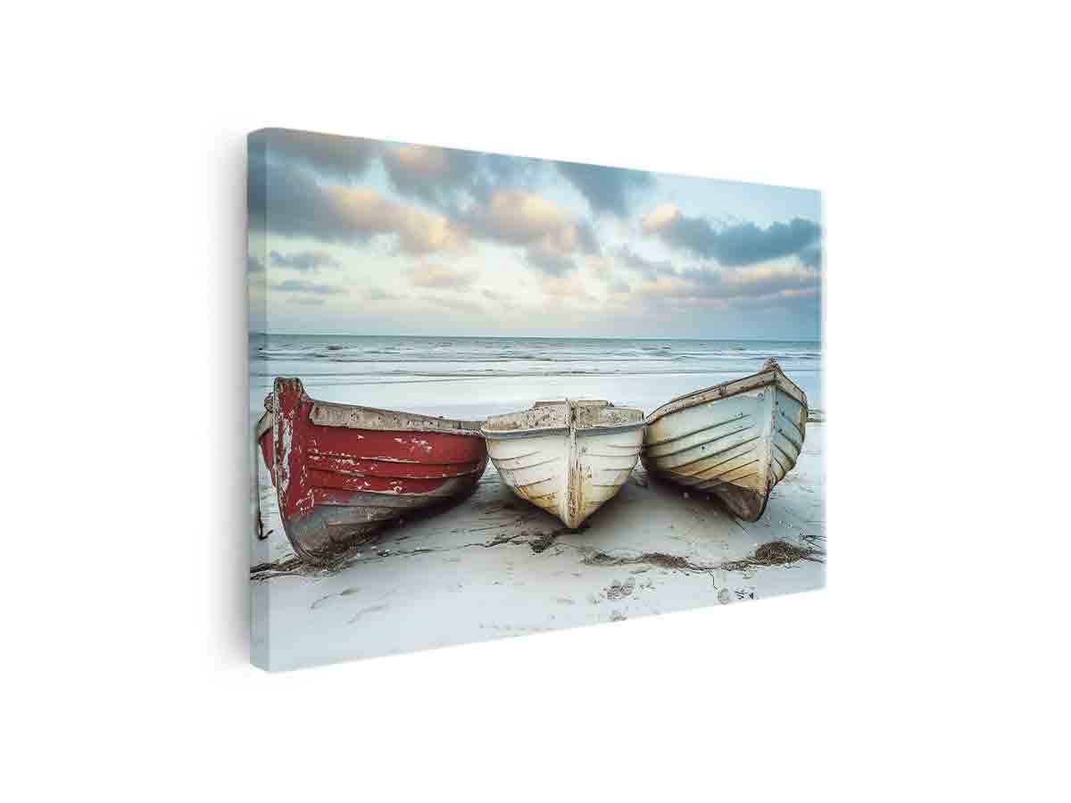 Weathered wooden boats on beach canvas art for coastal living room decor.