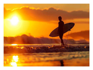 Surfer silhouette wall art with golden sunset and ocean waves for coastal bedroom decor.