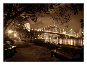 Sepia bridge canvas print with city lights and river reflections for modern office decor.