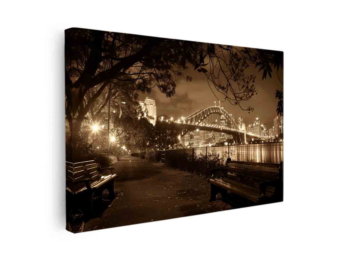 Sepia bridge canvas print with city lights and river reflections for modern office decor.