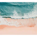 Aerial turquoise ocean waves over blush sand for calm coastal bedroom decor.