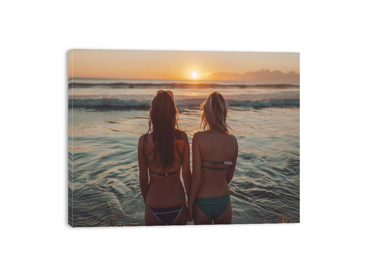 Coastal sunset beach canvas art with two women by the ocean for relaxed bedroom decor.