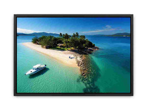 Tropical island aerial canvas art with turquoise ocean and sandy beach for coastal living room decor.