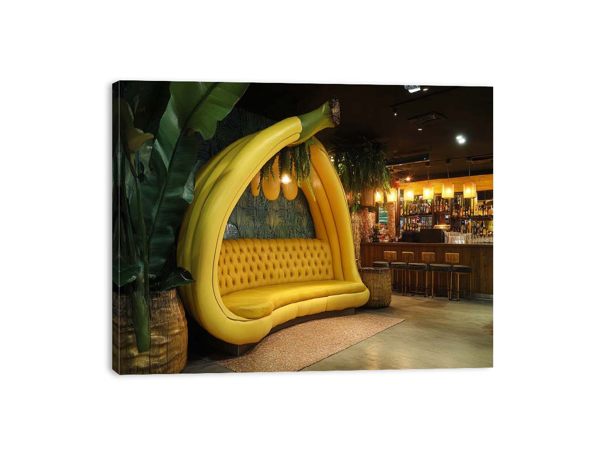 Oversized banana lounge artwork in tropical modern style for living room, home bar, and contemporary interior decor.