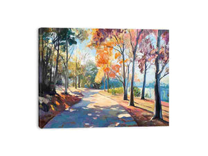 Sunlit autumn pathway canvas art with colorful trees and lakeside scenery for elegant living room decor.
