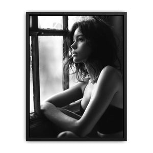 Black and white contemplative woman portrait canvas art with window light for modern bedroom and living room decor.