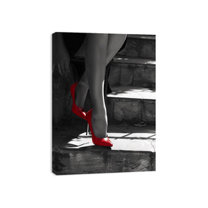 Red high heels on black and white stairs for glam fashion bedroom or hallway wall art.
