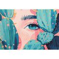Modern portrait wall art with blue eye and teal cactus pads for bold eclectic room decor.