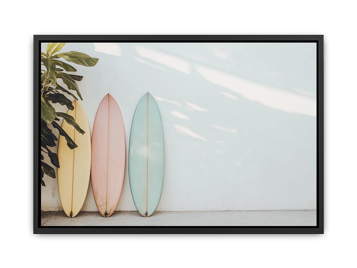 Pastel surfboards by a white wall for calm coastal bedroom decor.