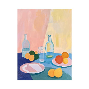 Pastel citrus still life with bottles and plates for modern kitchen decor.