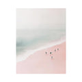 Minimalist coastal photography of surfers on a blush pink beach for modern bedroom decor.