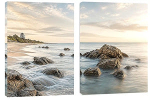 Coastal beach rocks diptych canvas art with soft ocean waves for serene living room decor.