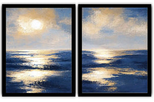 Blue and gold ocean canvas art with sunlit waves for luxury living room decor.