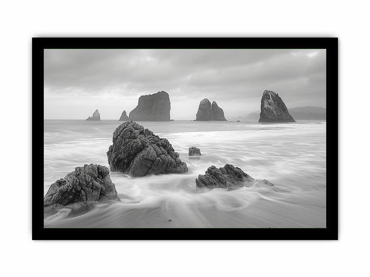 Black and white coastal landscape photography for serene living room decor