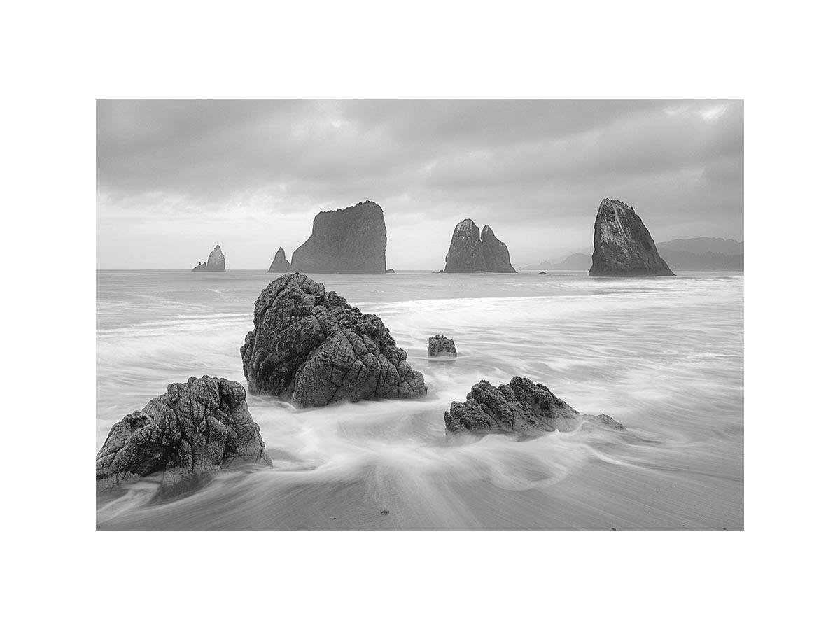 Black and white coastal landscape photography for serene living room decor