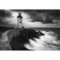 Moody black and white lighthouse wall art with storm clouds for modern living room decor.