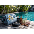 Spa towel and poolside canvas photography for relaxing bathroom decor.